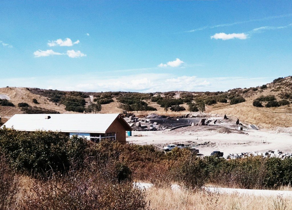 The amphitheater's tiered seating is now visible on the southwest side of Philip S. Miller Park.