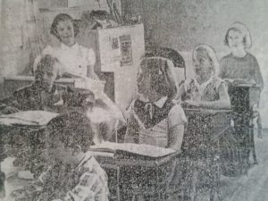 (Credit: Rocky Mountain News, 1956) Students who attended Oaklands School didn't seem to be bothered by the close quarters of the one-room schoolhouse.